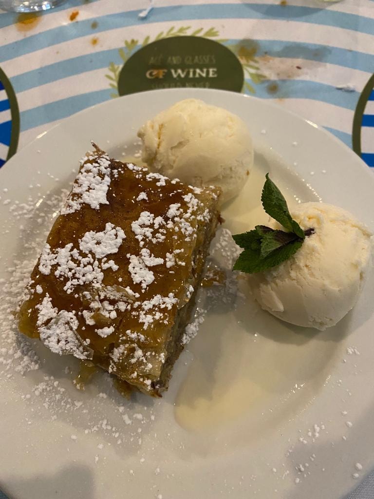 Pastry dessert with powdered sugar and ice cream