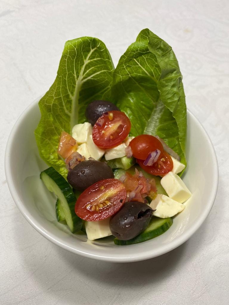 Greek salad with tomatoes, olives, cucumber and feta