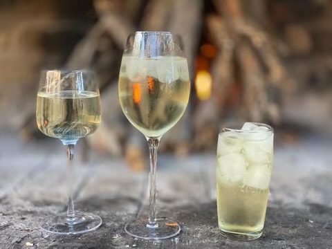 White wine and cold drinks by the boma fire