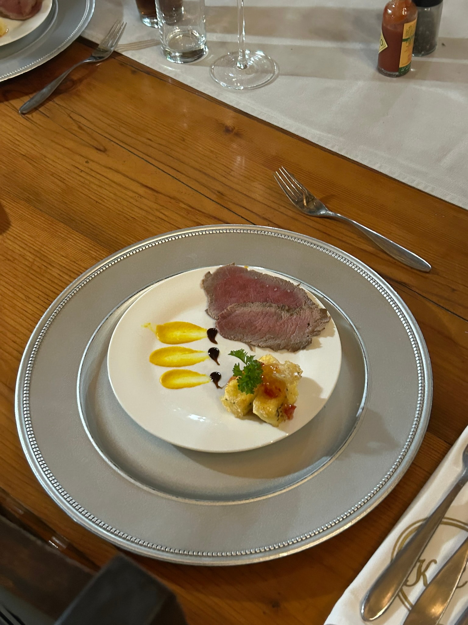 Plated rare beef steak with garnish