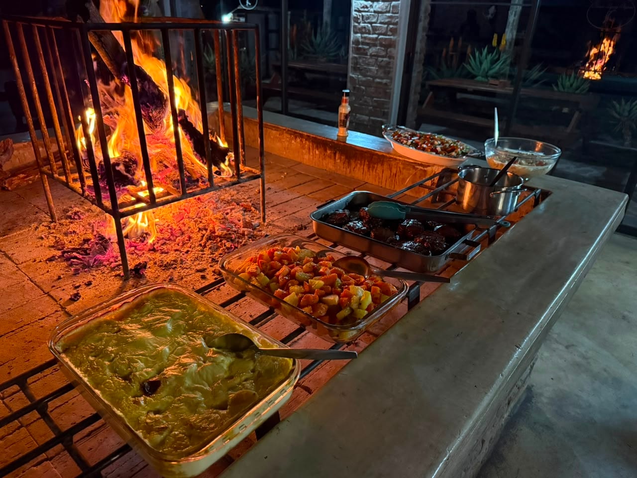 Outdoor fire pit dinner party setup
